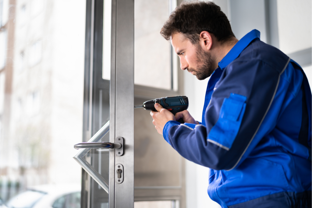 Locksmith reinforcing a door frame after a burglary in Paris